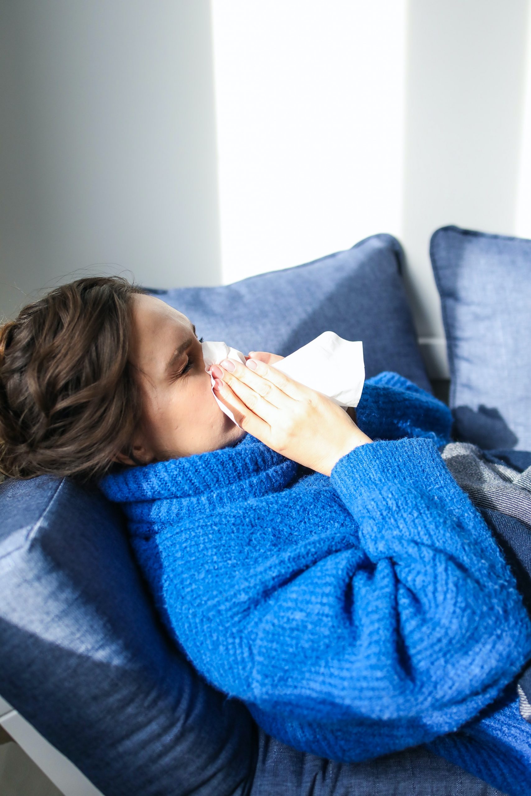 woman-in-blue-sweater-lying-on-bed-3873179-scaled